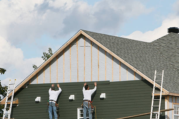 Professional Siding Replacement technician working in Elmont, NY